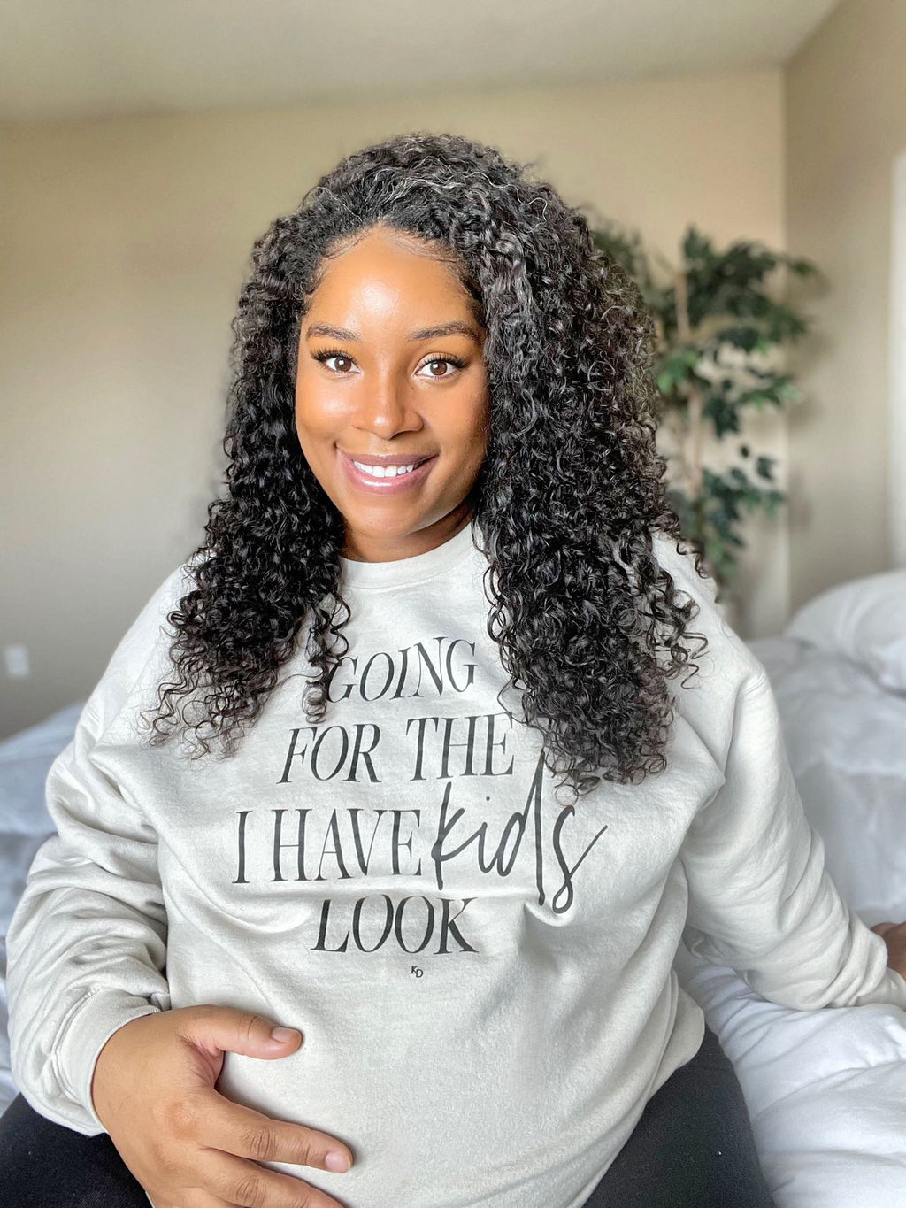 oversized sweatshirt or pullover in a light blue color, and forest green, graphic t-shirt with funny sayings for mom, womens clothing, maternity shirt, or stay at home mom outfit. pregnant woman modeling mom sweatshirt